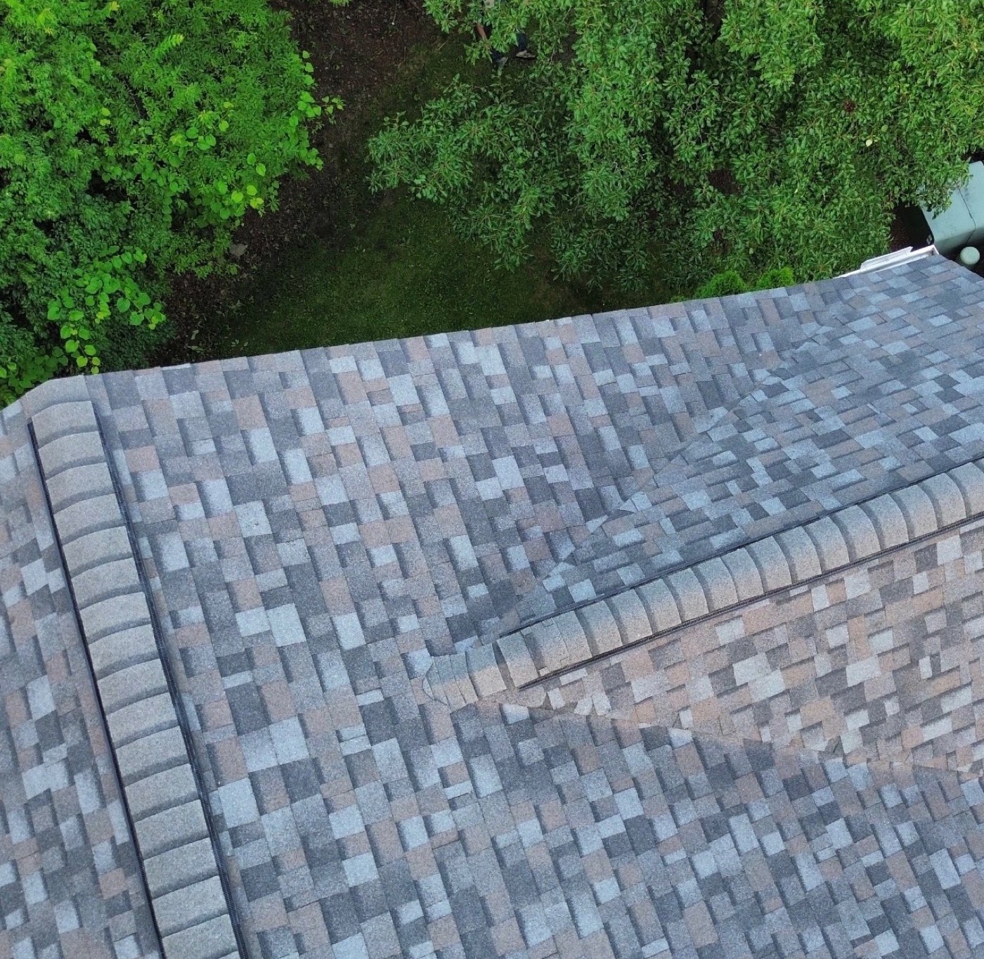 Close-up of new multi-tone blend shingles and hip ridge caps