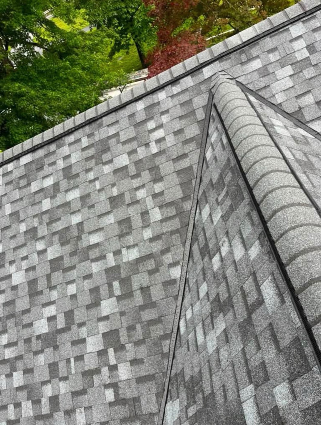 Close-up of new gray blend shingles on a hip roof