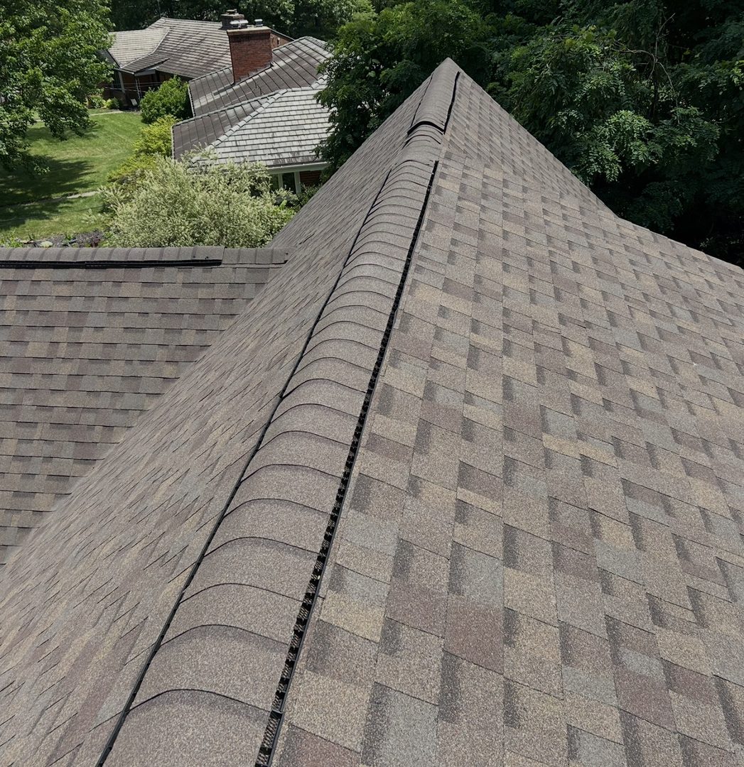 Fresh shingles along the roof ridge